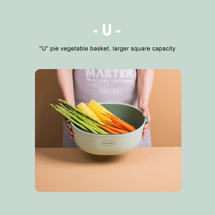 Light green U-shaped vegetable drain basket holding fresh vegetables