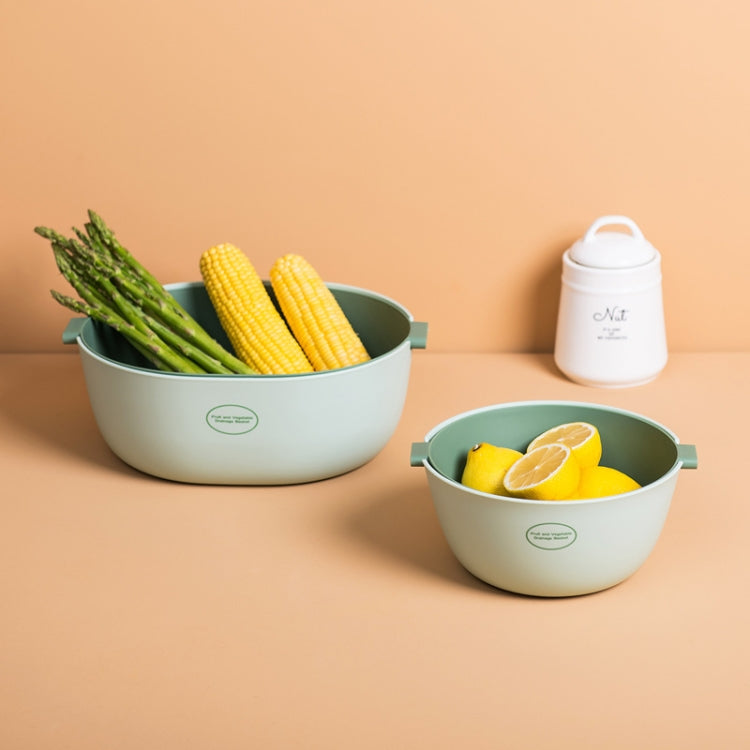 Light green plastic vegetable drain baskets with corn and asparagus