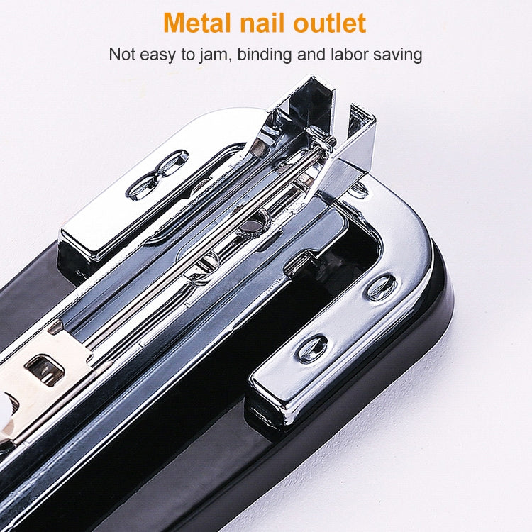 Black metal nail outlet area on a compact stapler body