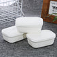 Set of white plastic soap boxes with hinged lids and drainage vents