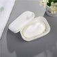 White plastic soap holder with lid open and soap inside