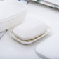 Close-up of white plastic sealed soap box with embossed soap