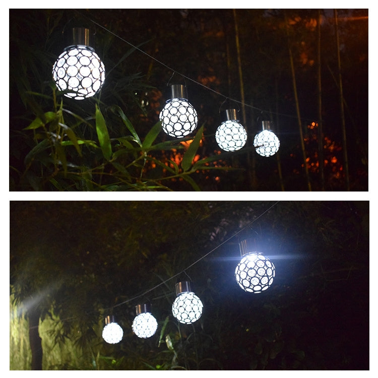 Set of solar hollow ball pendant lights with glowing white faceted globes