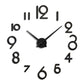 Black acrylic wall clock with bold 3D numerals and metal-style hands
