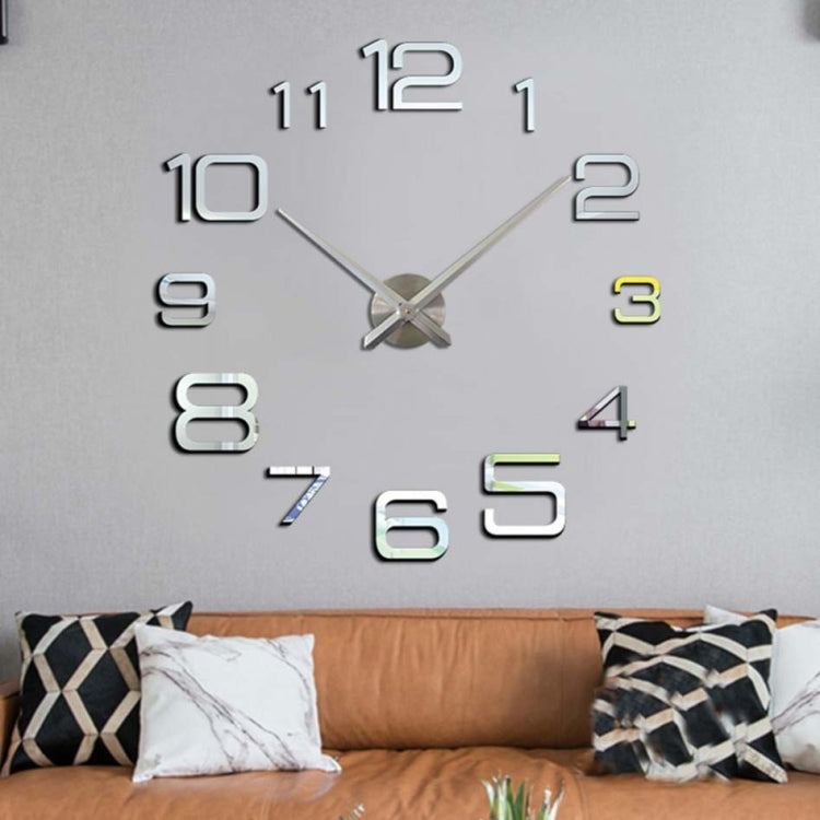 Silver-tone digital acrylic wall clock with raised numerals and cross hands