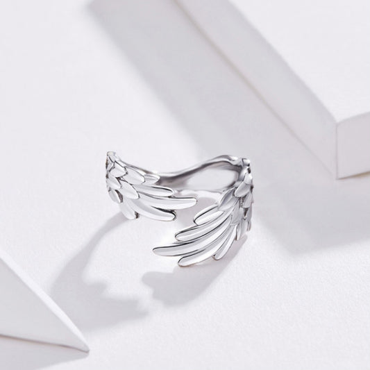 Sterling silver feather-wing open ring with layered wing feathers and adjustable band