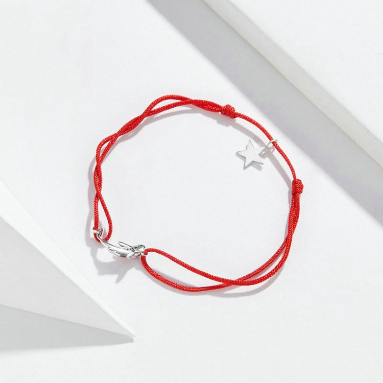 Red braided string bracelet with sterling silver star charm and silver clasp
