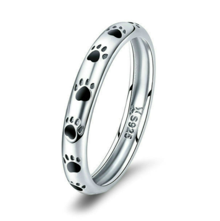 Sterling silver ring with black paw print enamel, smooth inner band marked S925