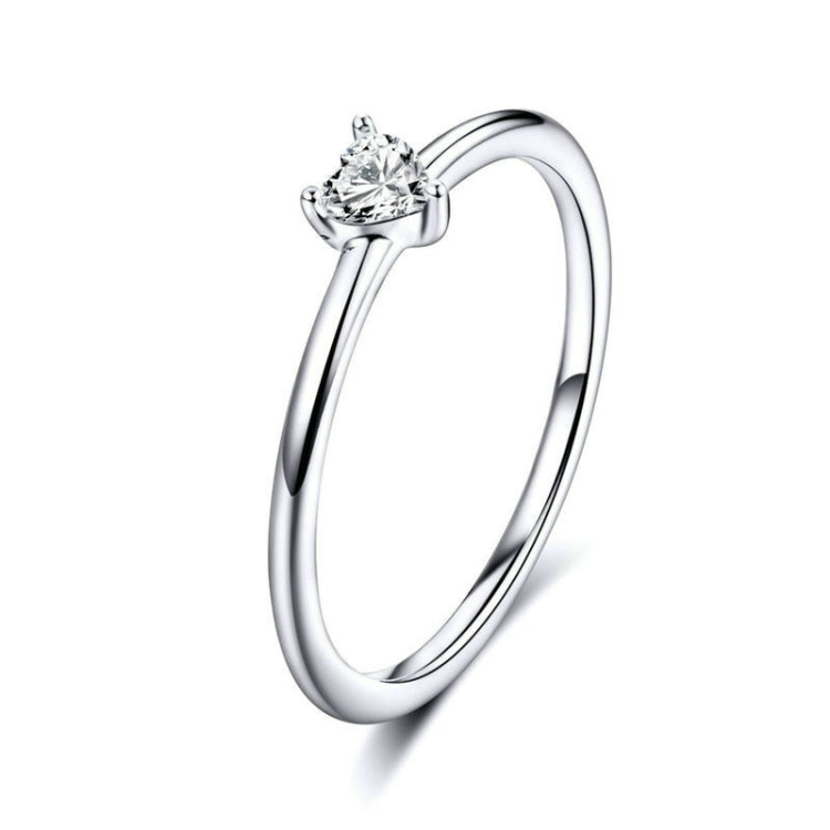 Heart-shaped clear CZ solitaire ring, front view on smooth polished band
