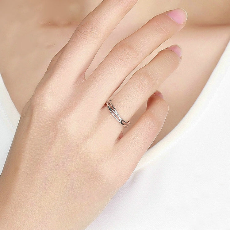 Polished silver open triple-band ring worn on finger, minimal stacked design