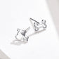 Sterling silver dog bone stud earrings with hollow outline, angled profile