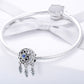 Sterling silver bracelet with dreamcatcher bead charm and feather dangle accents