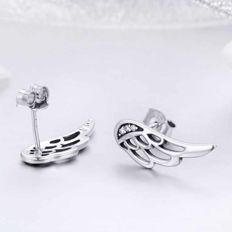 Silver wing stud earrings, side view showing earring back posts
