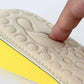 Close-up of beige textured EVA insole footbed with raised cushion pattern.