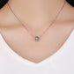 Sterling silver round pendant with black enamel pattern and crystal center on chain