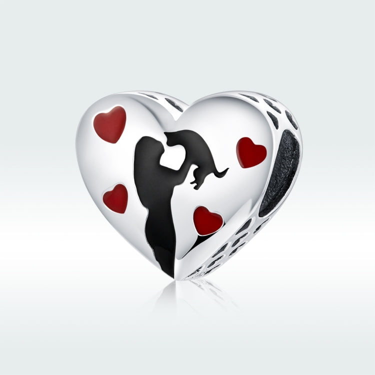Heart-shaped silver pendant charm with black silhouette, red hearts, and openwork edge