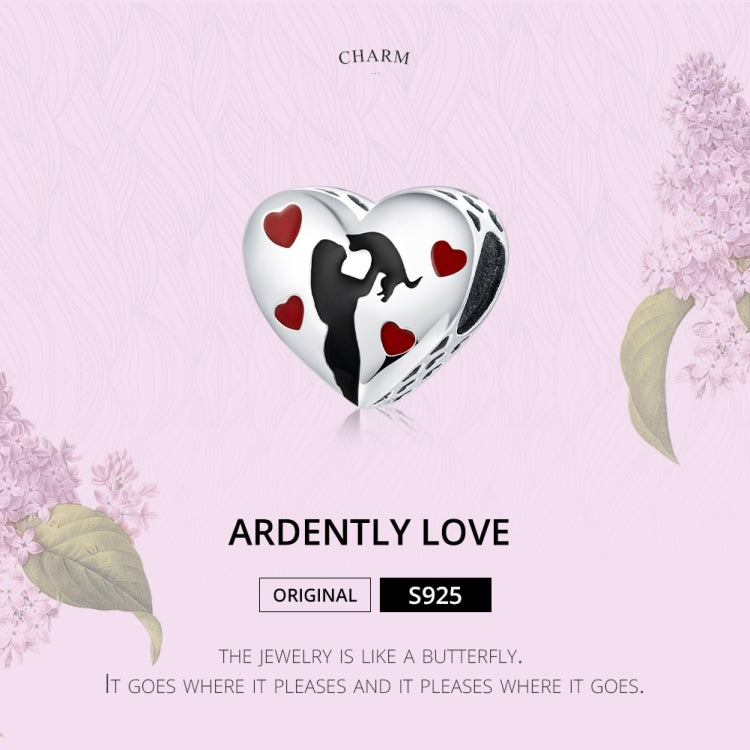 Small heart-shaped enamel charm with black silhouette and red heart accents on silver