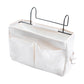 White hanging bedside storage bag with multiple compartments and front divider pouch