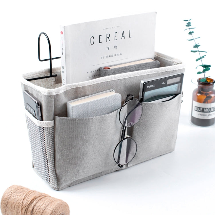 Hanging storage bag with open top compartments and eyeglasses-style pocket holder