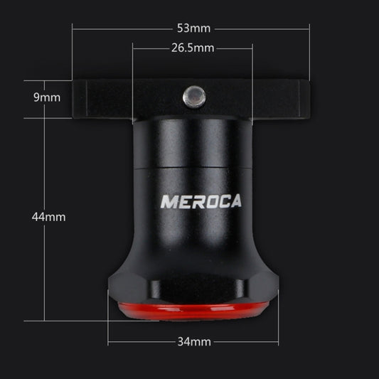 Black bike tail light with red lens strip, showing compact size details.