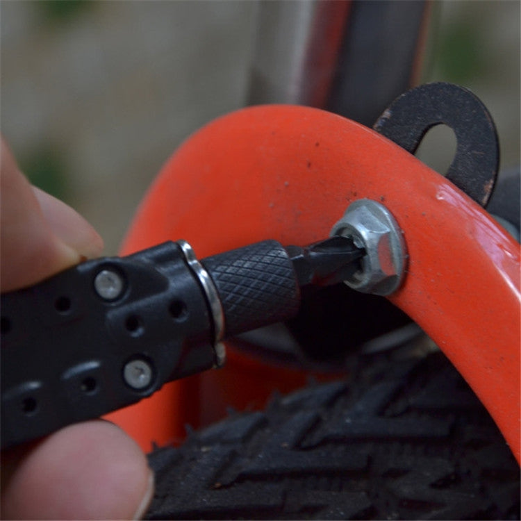 Close-up of mini screwdriver handle with bit inserted into orange tool part