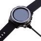Black magnetic charger connected to a watch on wrist