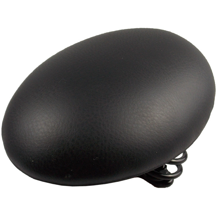 Black bicycle saddle cushion with textured top and coiled spring suspension