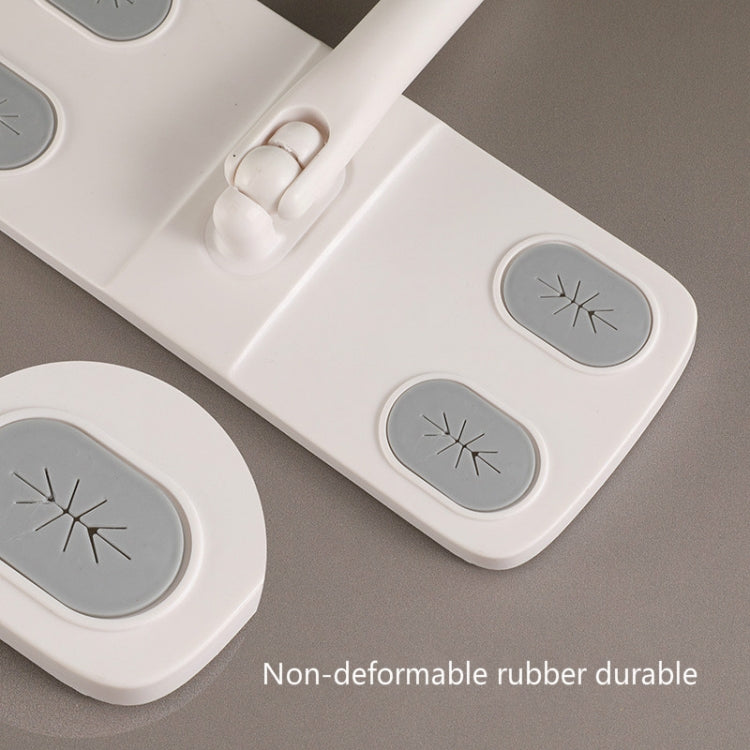 Close-up of flat dust mop head with four gray rubber icons and central clip