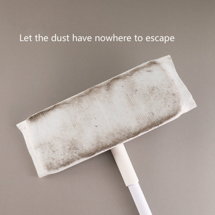 Dust removal mop with used, gray-stained disposable pad attached
