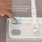 Hand pressing corners of dust removal paper into mop head cavity