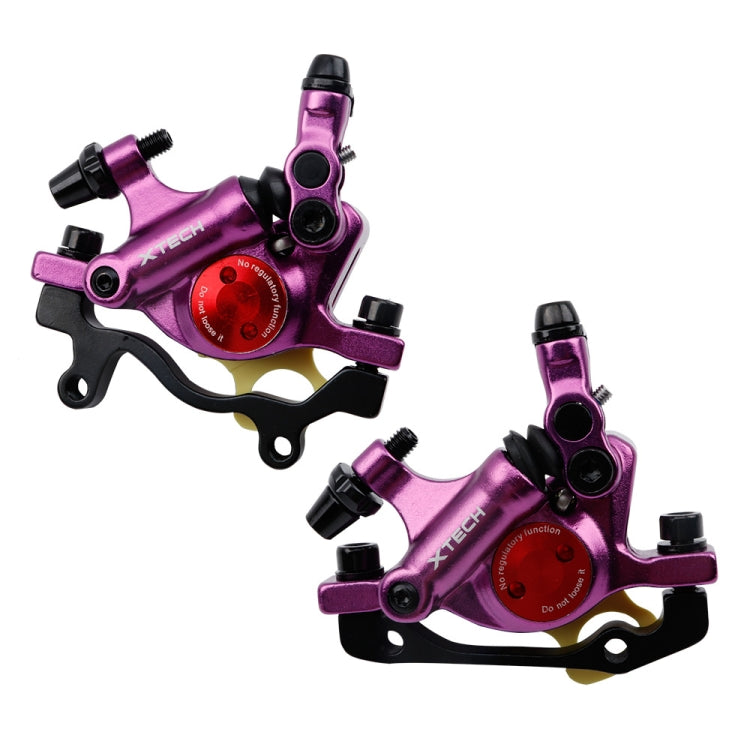 Purple hydraulic disc brake caliper pair with black mounting hardware