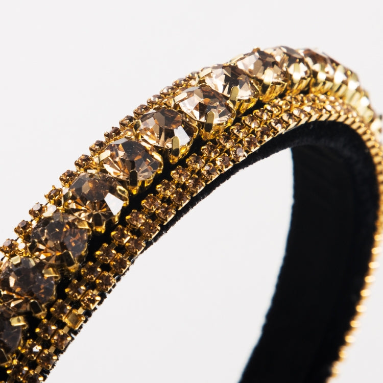 Gold rhinestone headband with oversized amber crystal-like stones