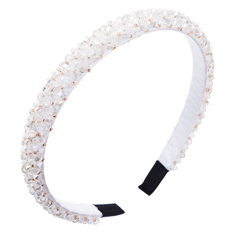 Crystal beaded fabric headband in white with black fabric tips and a curved fit