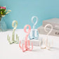 Rotating belt hooks with four-prong ring design in pastel blue, pink, and white