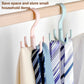 Rotatable belt hook set on a light wood bar, holding multiple striped ties