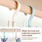 Four-claw ring belt hook on a light wood bar, white and light blue plastic