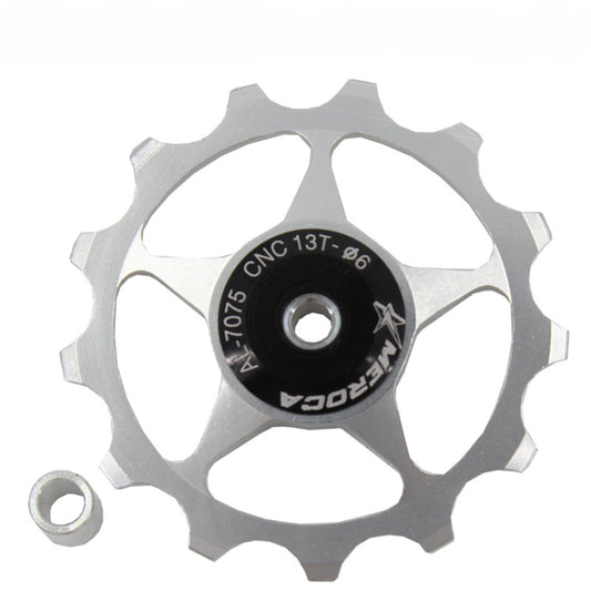 Silver 13T rear derailleur guide wheel with black center disc and metal spacer