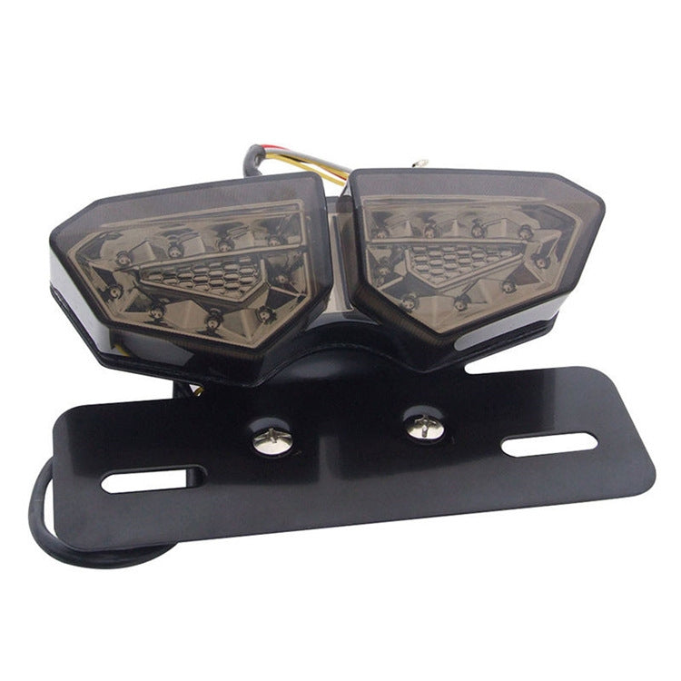 Motorcycle LED tail light, black base with dual clear amber lamp sections and mounting plate