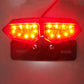 Motorcycle LED tail light with red brake lights glowing on dual lamp sections