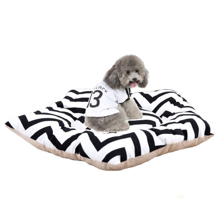 Pet sleeping mat bed with black-and-white zigzag cover, with small dog resting