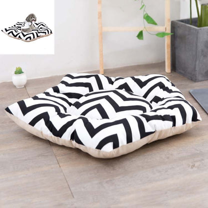 Small pet sleeping mat bed with black-and-white zigzag cover and light beige base