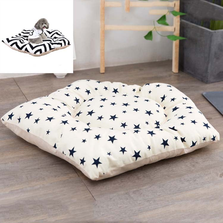 Pet sleeping mat bed with white cover and navy star pattern, beige bottom edge