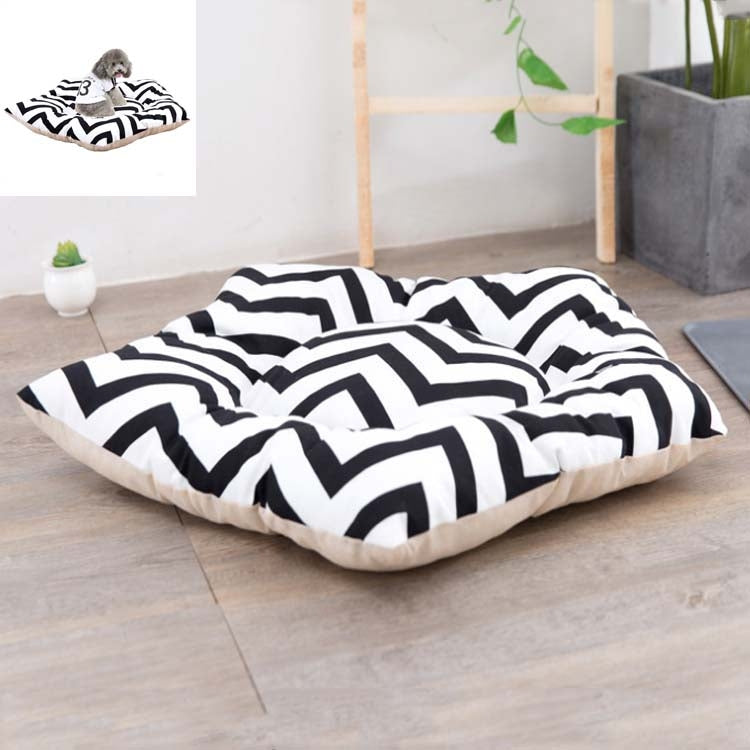 Dog sleeping mat bed featuring black zigzag stripes on a white top with cream border