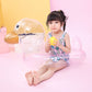 Transparent duck pool ring with golden beak; child sitting inside