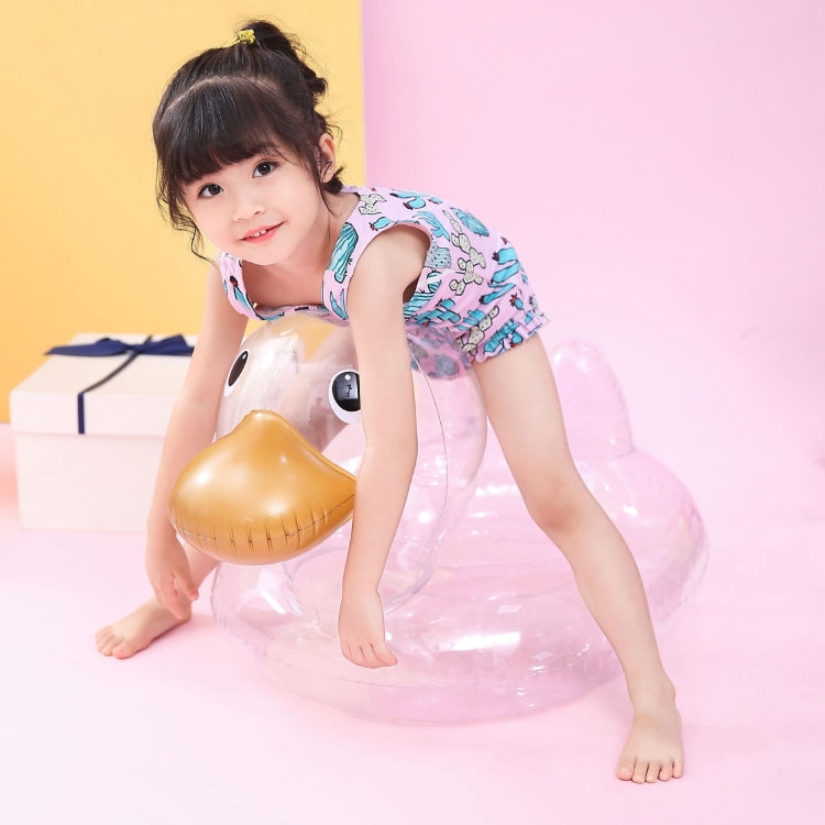 Transparent duck-shaped swimming ring with golden beak; child posing while kneeling