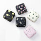 Set of square zip pouches for sanitary napkin storage, assorted floral and animal prints