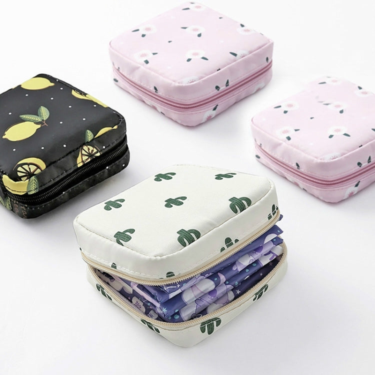 Stacked square zip sanitary napkin storage pouches in pink, white, and black patterns