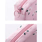 Pink square zip pouch for sanitary napkin storage, close-up of zipper and stitching