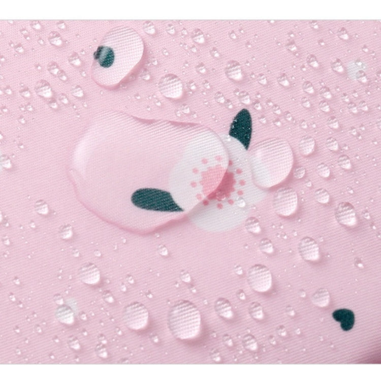 Pink fabric sanitary napkin storage pouch with water droplets, close-up texture