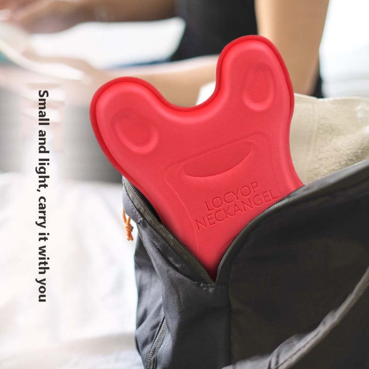 Red cervical neck pillow massager placed on the shoulder for targeted support